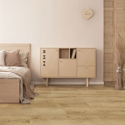 mocha colored bedroom with woodlook flooring